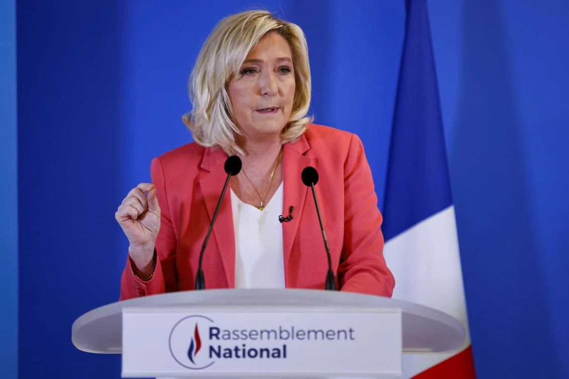 France’s Le Pen, at record high in polls, proposes hijab ban