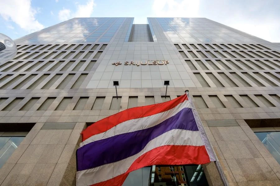 A Thai national flags flutters in the wind in front of the Srijulsup building, housing the offices of Covid-19 coronavirus vaccine producer Siam BioScience, in Bangkok on January 25, 2021. (File/AFP)