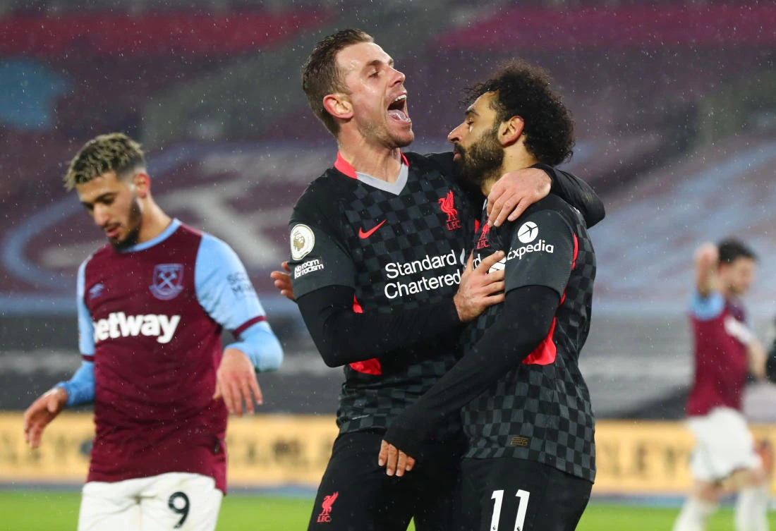 Liverpool's Mohamed Salah celebrates scoring their second goal with Jordan Henderson Pool. (Reuters)