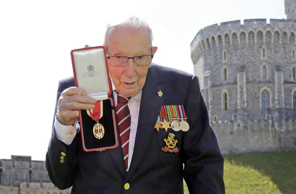 In this file photo, Captain Sir Thomas Moore poses for the media after receiving his knighthood from Britain's Queen Elizabeth, during a ceremony at Windsor Castle in Windsor, England. (File/AP)