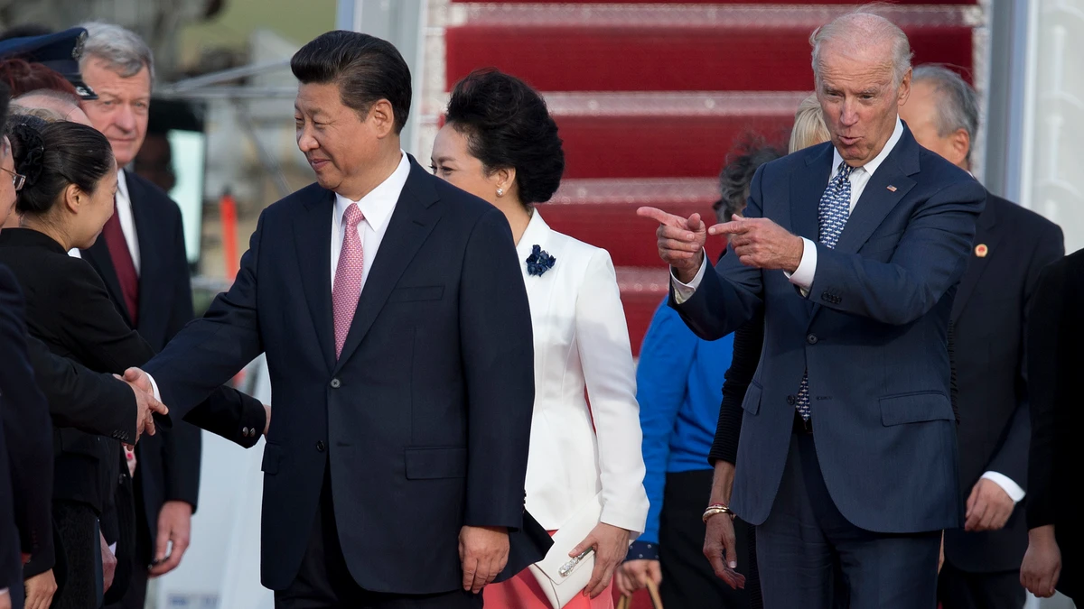 Then-Vice President Joe Biden, Chinese President Xi Jinping and his wife Peng Liyuan at Andrews Air Force Base, Maryland, Sept. 24, 2015. (AP Photo)