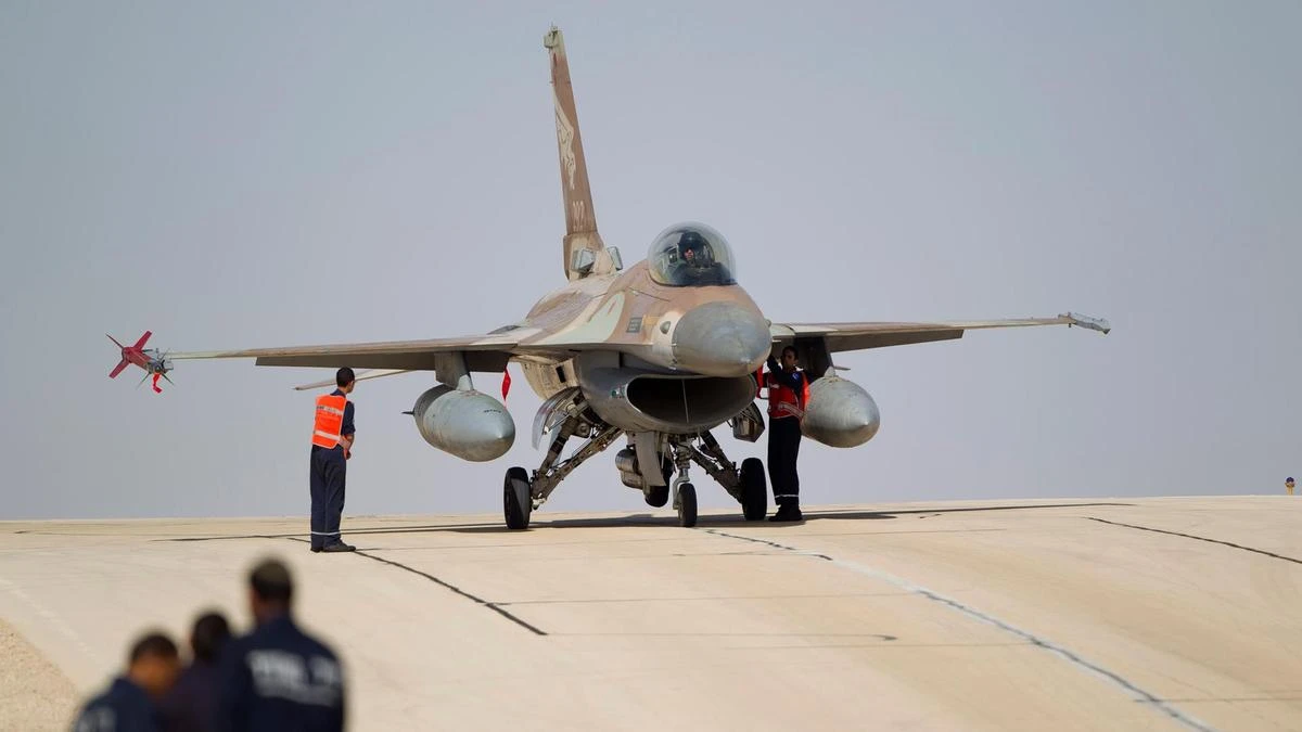 Technicians inspect an Israeli Air Force F-16 jet at Ovda Airbase near Eilat, southern Israel. (AP Photo)