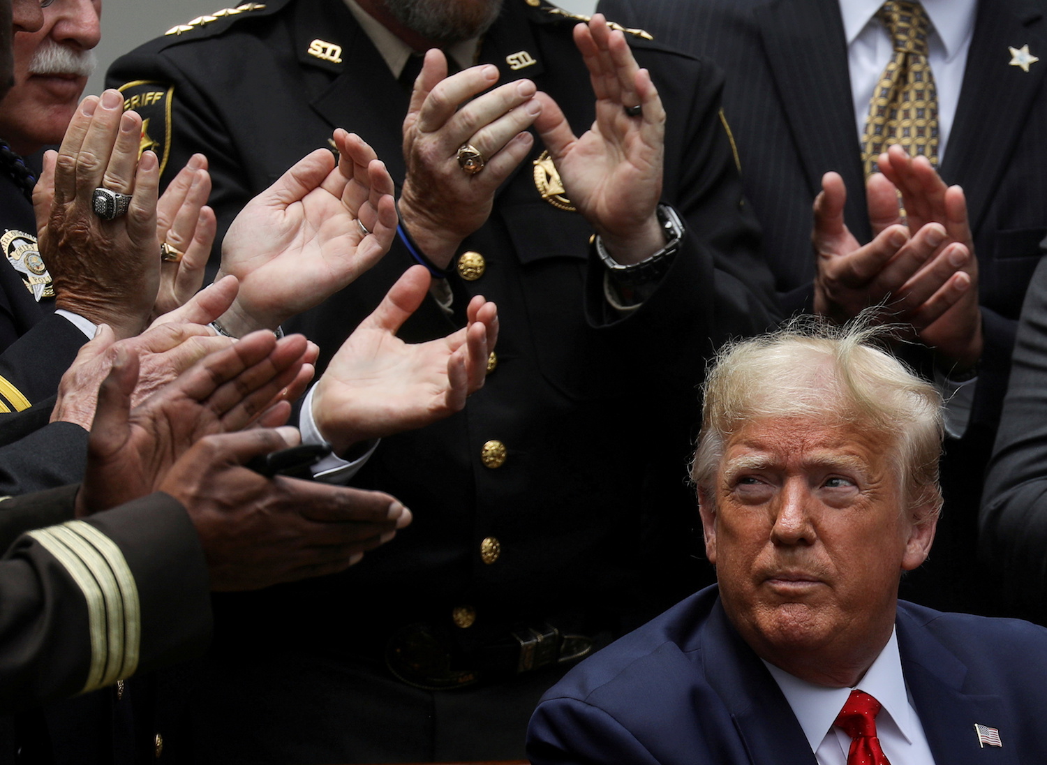 Donald Trump listens to applause after signing an executive order on police reform at the White House in Washington, US. (File/Reuters)