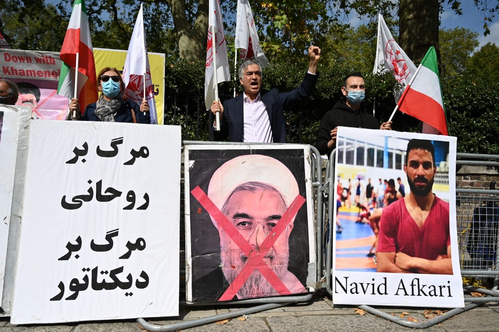 Protesters demonstrate outside the Iranian embassy in London against the execution of Iranian wrestler Navid Afkari. (File/AFP)