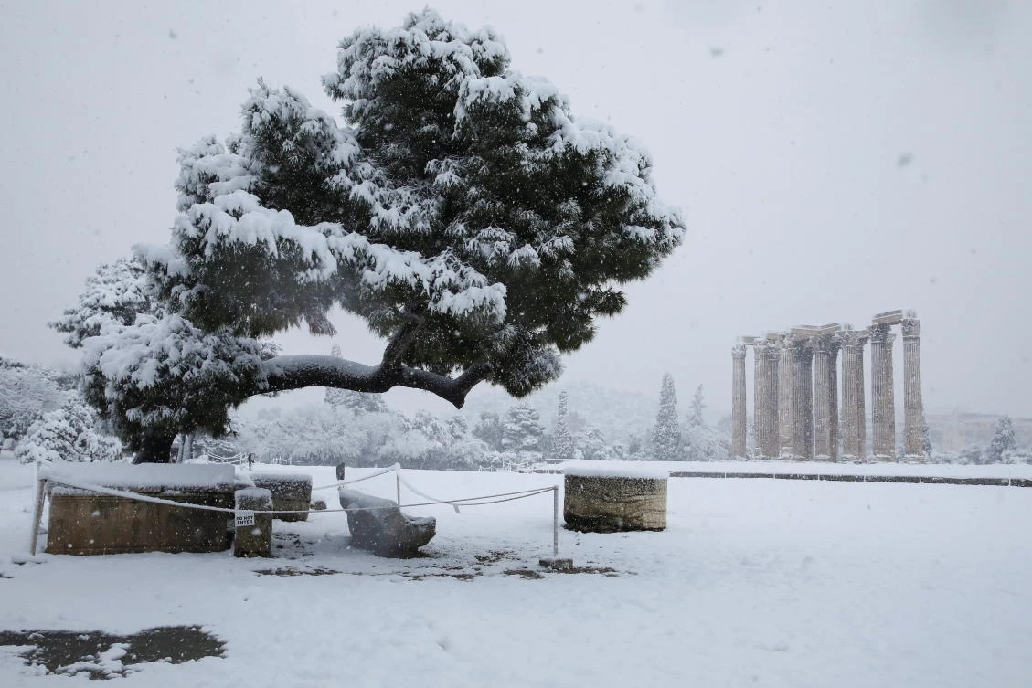 General view of the snow-covered archaeological site of the Temple of Zeus during heavy snowfall in Athens, Greece, February 16, 2021. REUTERS/Costas Baltas