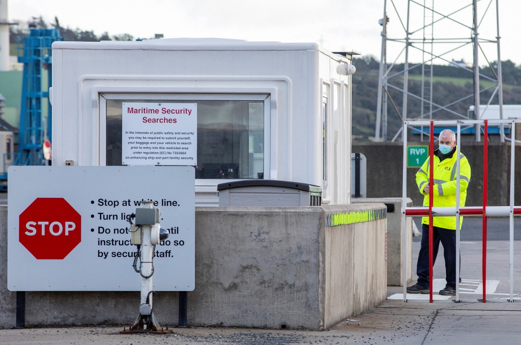An official waits at the entrance to the Port of Larne in County Antrim, Northern Ireland on January 1, 2021. (AFP)