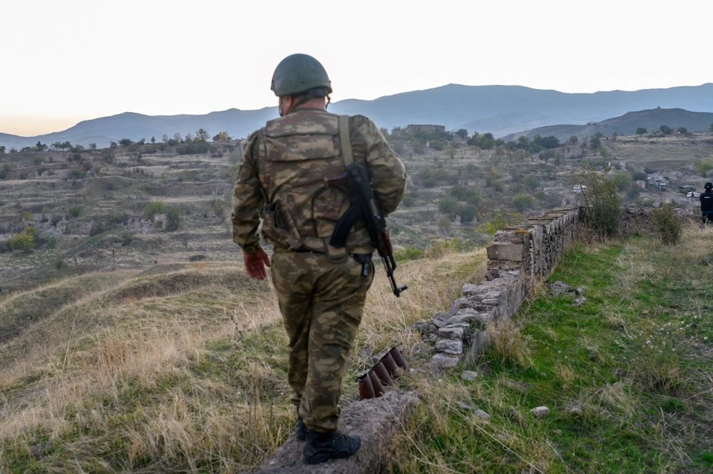 An Azeri soldier stands in the city of Jabrayil in October after Azeri forces regained control during fighting with Armenia over the breakaway region of Nagorno-Karabakh. (AFP/File)