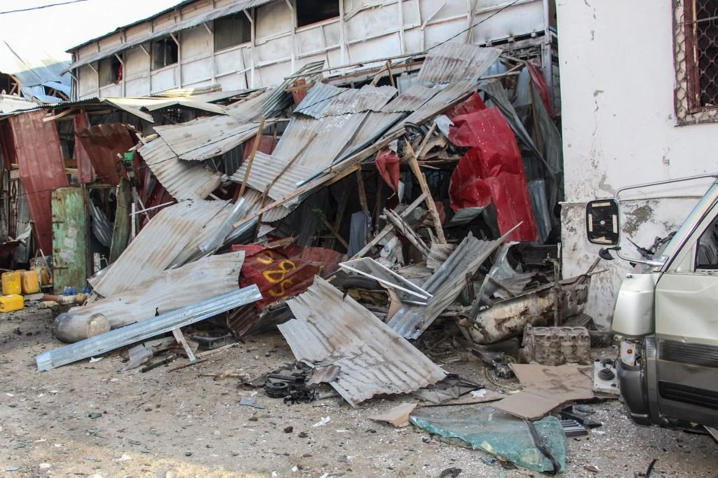 Debris remain at the blast site from a suicide car bombing attack from the day before at the side of Afrik Hotel in Mogadishu, Somalia, on Feb. 1, 2021. (AFP)