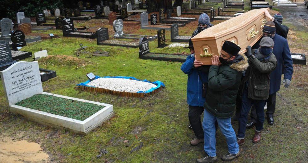 According to the British Islamic Medical Society, COVID-19 has disproportionately affected the UK’s Muslim community. (AFP)
