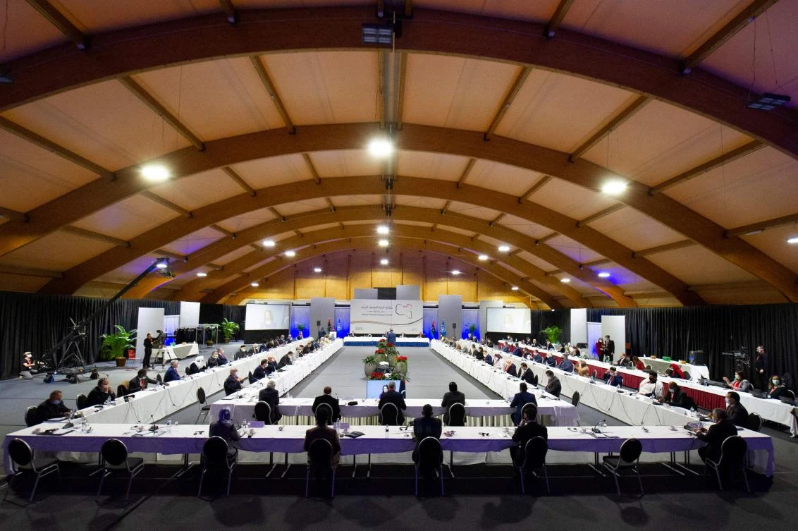 This handout picture made available by the United Nations (UN) shows delegates standing during the national anthem at the opening of the Libyan Political Dialogue Forum on February 1, 2021 at an undisclosed location near Geneva to choose a new temporary executive to lead the war-scarred country through a transition until scheduled December elections. (AFP)