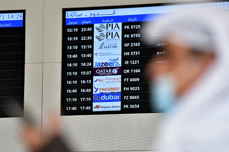 People wait for the arrival of relatives at King Khalid International Airport in the Saudi capital Riyadh on the first commercial flight from Qatar, on January 11, 2021. (AFP/File)