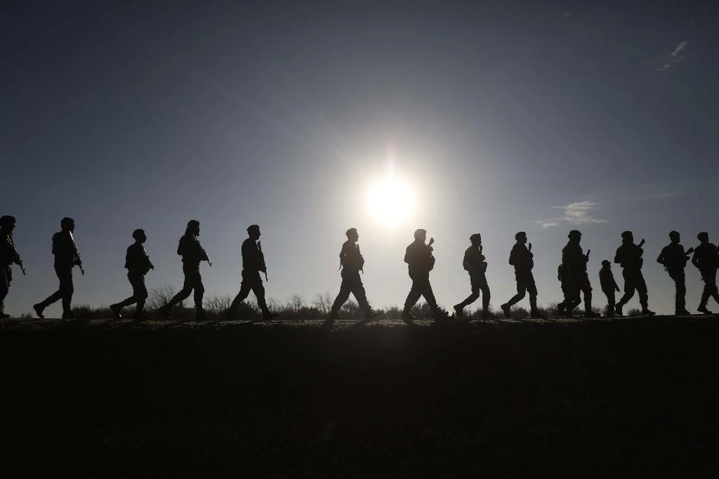Turkey and its Syrian proxies, above, seized control of Ras Al-Ain during an October 2019 offensive. (AFP file photo)