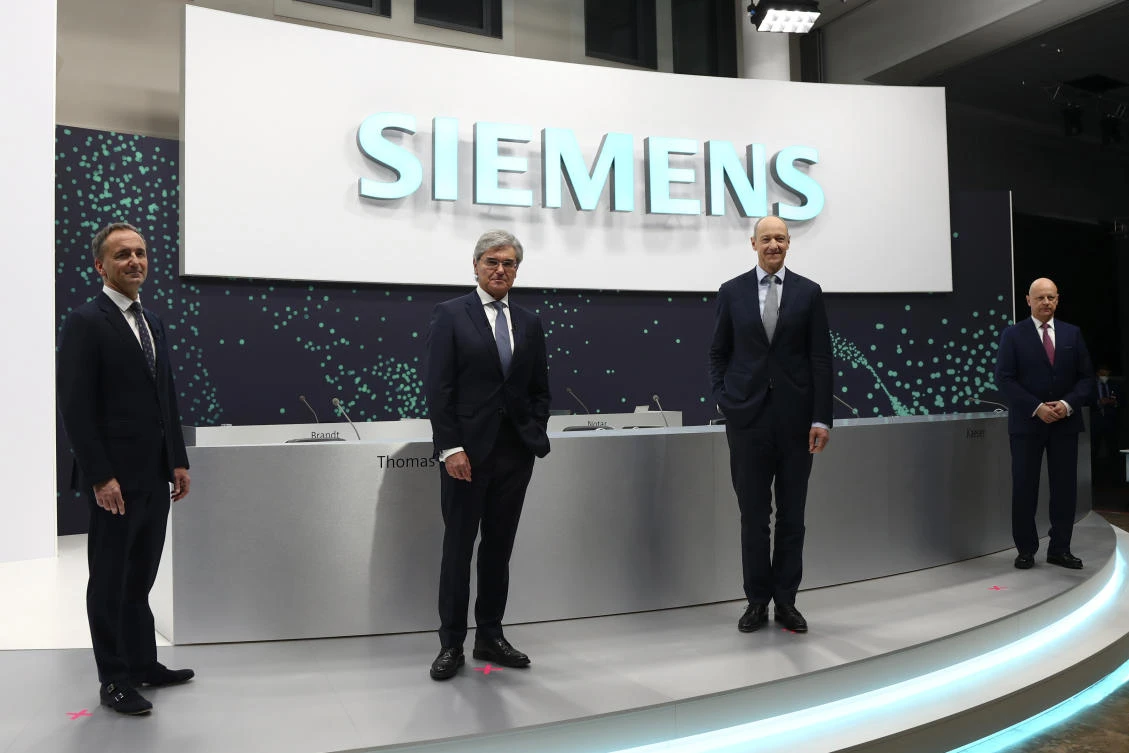 Jim Hagemann Snabe, chairman of the supervisory board of industrial conglomerate Siemens, from left, CEO Joe Kaeser, deputy CEO Roland Busch, and CFO Ralf P. Thomas pose prior to the start of the virtual annual shareholders meeting in Munich, Germany, Wednesday, Feb. 3, 2021. (AP)