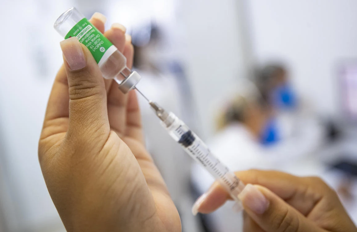 A nurse assistant prepares a dose of the Oxford-AstraZeneca vaccine for COVID-19 during a priority vaccination program for health workers at a community medical center in Sao Paulo, Brazil, Wednesday, Feb. 3, 2021. (AP)