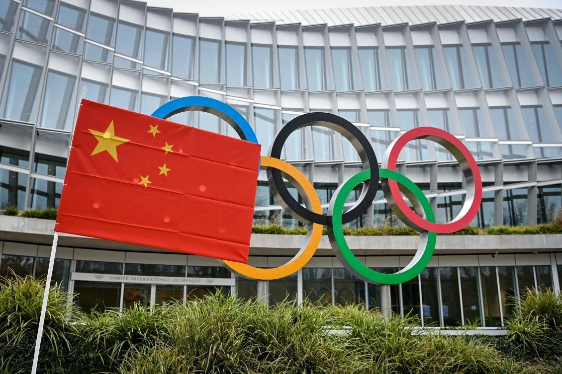 A Chinese flag flutters in front of the IOC headquarters during a protest by activists of the International Tibet Network against the Beijing 2022 Winter Olympics on Februay 3, 2021 in Lausanne. (AFP)