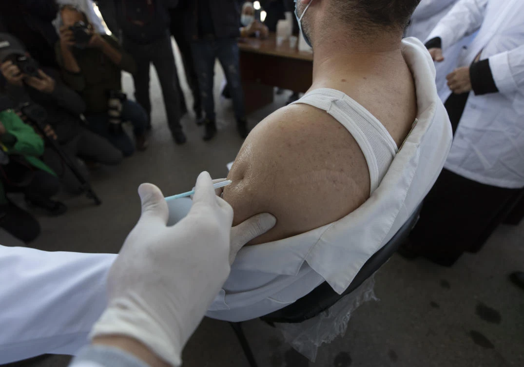 In a new report released Thursday, Feb. 4, 2021, the International Monetary Fund said broad access to different coronavirus vaccines remains crucial for an economic recovery in the Mideast. (File/AP)