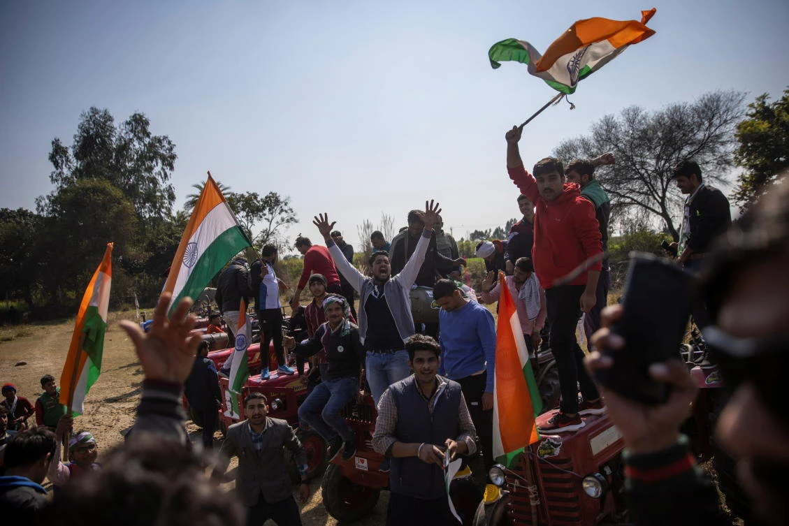 People shout slogans during a Maha Panchayat or grand village council meeting as part of a farmers' protest against farm laws at Bhainswal in Shamli district in the northern state of Uttar Pradesh, India, February 5, 2021. (Reuters)