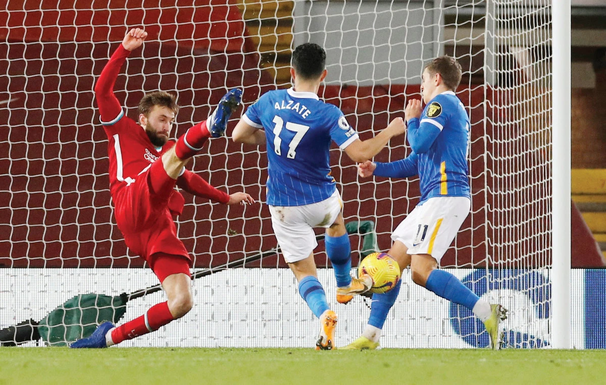 Brighton & Hove Albion’s Steven Alzate scores a goal against Liverpool during their match at Anfield, Liverpool. The Reds will play Manchester City on Sunday. (Reuters)