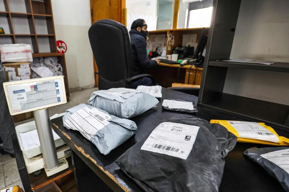 Mail packages are seen at a post office in the city of al-Bireh, about 15 kilometres north of Jerusalem in the occupied West Bank, on February 7, 2021. (AFP)