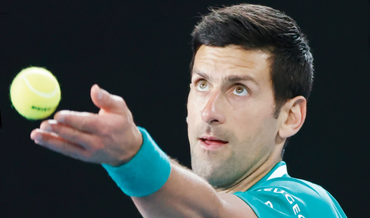 Serbia’s Novak Djokovic serves to France’s Jeremy Chardy at the Australian Open in Melbourne on Monday. (AP)