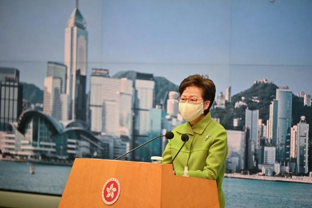 Hong Kong chief executive Carrie Lam confirmed that while residents could own multiple passports, dual nationality was not recognized in Hong Kong under China’s nationality law. (AFP)