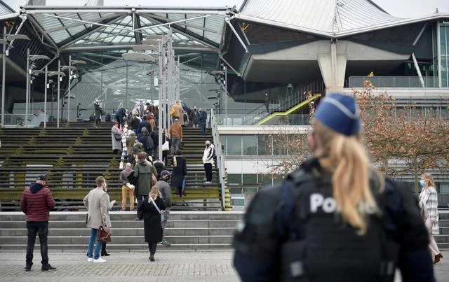 People wait to enter the court building in Antwerp, Belgium. (Reuters)