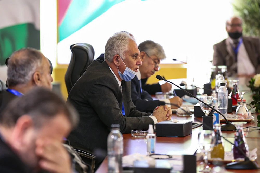 This handout image shows Bassam Al-Salhi (C), the general secretary of the Palestinian People’s Party, attending the Palestinian National Dialogue hosted by Egypt’s General Intelligence Service in the capital Cairo on Feb. 8, 2021. (AFP/Egypt’s State Information Service)