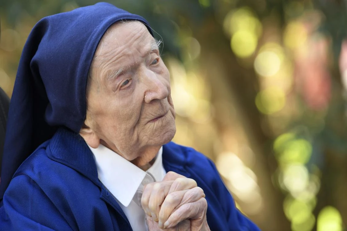Sister Andre, Lucile Randon in the registry of birth, prays in a wheelchair on the eve of her 117th birthday on February 11. (AFP)