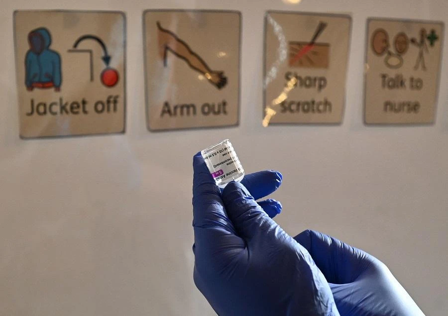 A health worker prepares a dose of the AstraZeneca/Oxford Covid-19 vaccine at a temporary vaccine centre set up at City Hall in Hull, northeast England on February 10, 2021. (File/AFP)