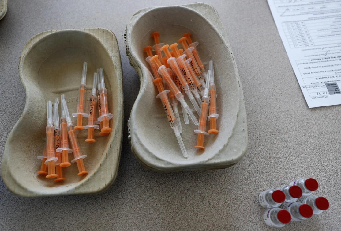 Vials of the AstraZeneca vaccine and loaded syringes wait to be administered to homeless persons at the Welcome Centre in Ilford, east London, Friday, Feb. 5, 2021. (AP)