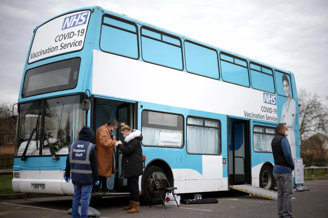 A person gets off a mobile vaccination centre for the coronavirus disease (COVID-19) after receiving the vaccine, in Thamesmead, London, Britain, February 14, 2021. (Reuters)