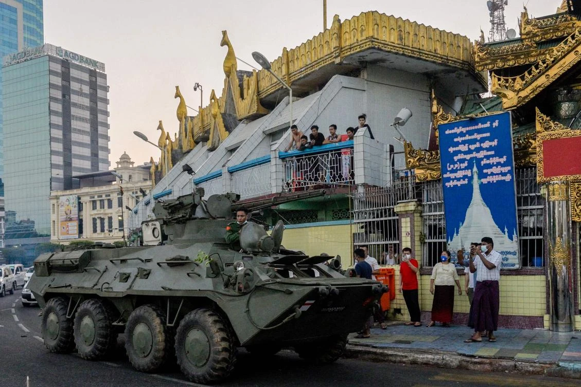 An armoured vehicle drives next to the Sule Pagoda, following days of mass protests against the military coup, in Yangon on February 14, 2021. (AFP)