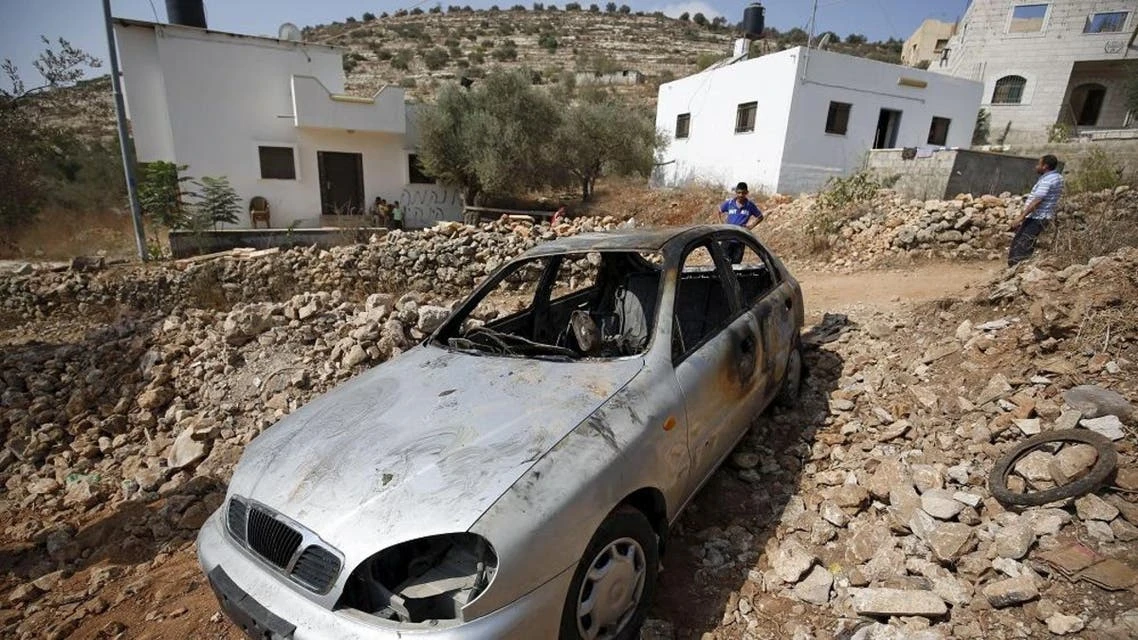 A file photo shows a car belonging to Palestinian residents, which some said was burnt by alleged Jewish settlers, in the occupied West Bank. (Reuters)