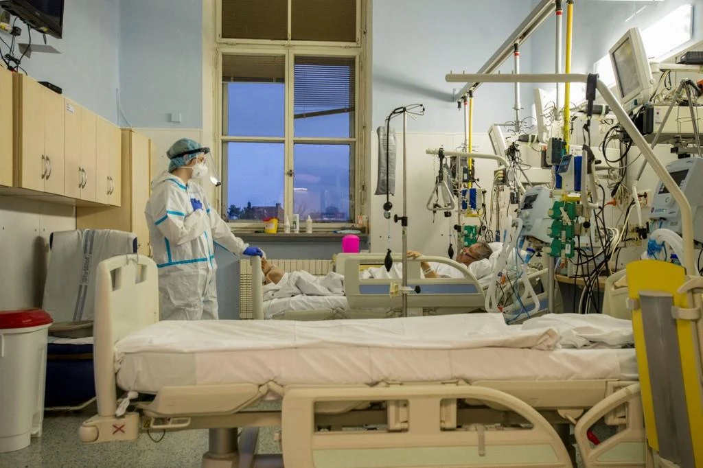 Volunteer and medical student Tereza Zalesakova wearing personal protective equipment (PPE) treats a Covid-19 patient in an intensive care unit (ICU) at Prague’s General University Hospital on Jan. 7, 2021. (File/AFP)
