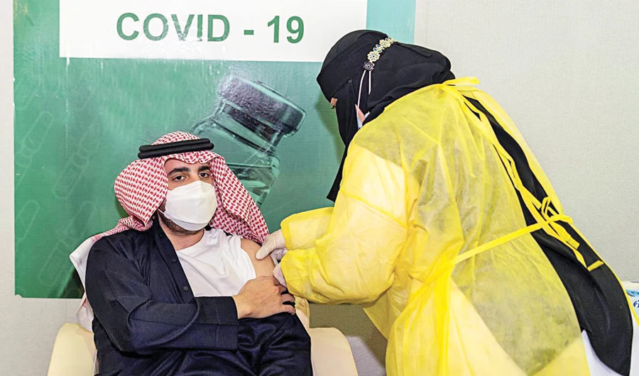 Jouf Gov. Prince Faisal bin Nawaf bin Abdul Aziz receives the first dose of coronavirus vaccine in Sakaka on Thursday. (SPA)