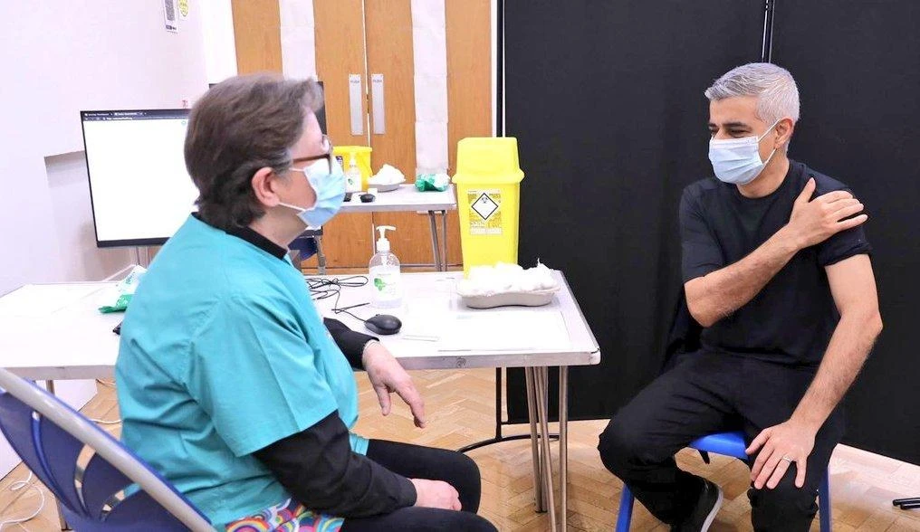 London mayor takes COVID-19 vaccine, urges UK minorities to follow suit