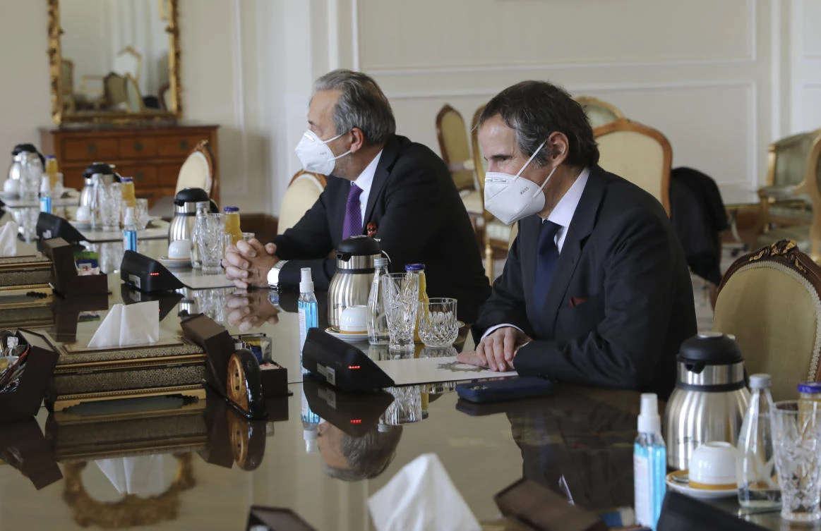 Director General of International Atomic Energy Agency, IAEA, Rafael Mariano Grossi, right, looks towards Iranian Foreign Minister Mohammad Javad Zarif during a meeting, in Tehran, Iran, on February 21, 2021. (AP)