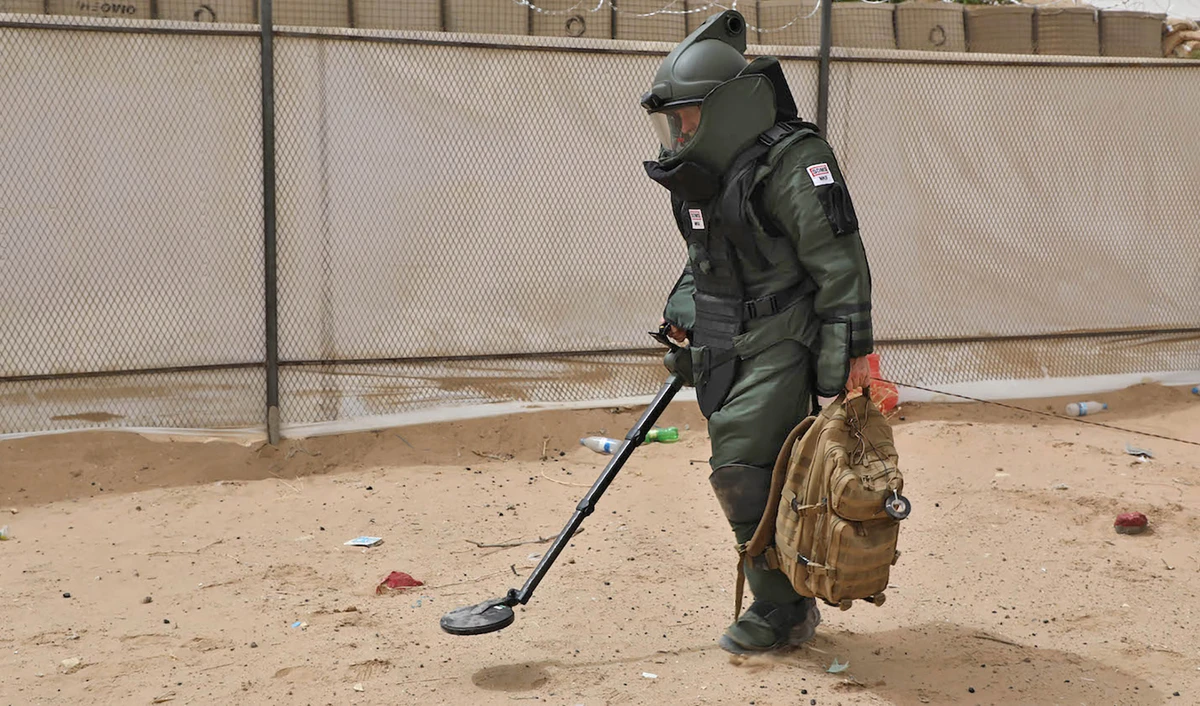 This undated photograph released by The Saudi Project for Landmine Clearance (MASAM) shows a demining expert searching for landmines in Yemen. (Photo courtesy: Project Masam)