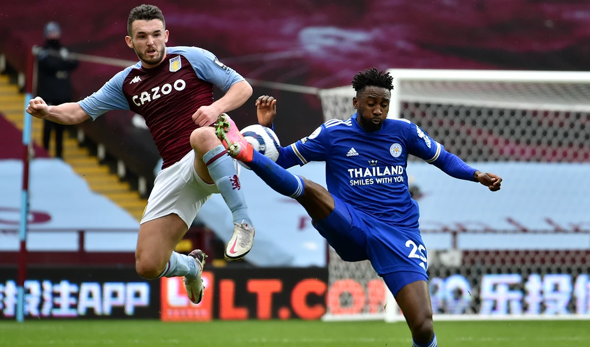 Aston Villa’s John McGinn, left, and Leicester’s Wilfred Ndidi vie for the ball at the Premier League match in Birmingham on Sunday. (AFP)