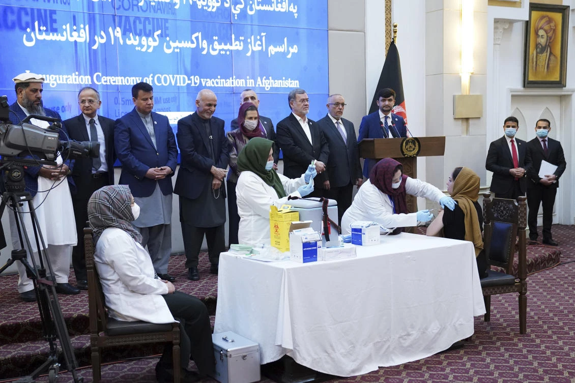Afghanistan has started its first implementation of the COVID-19 vaccine during a ceremony at the Afghan presidential palace. (AP)