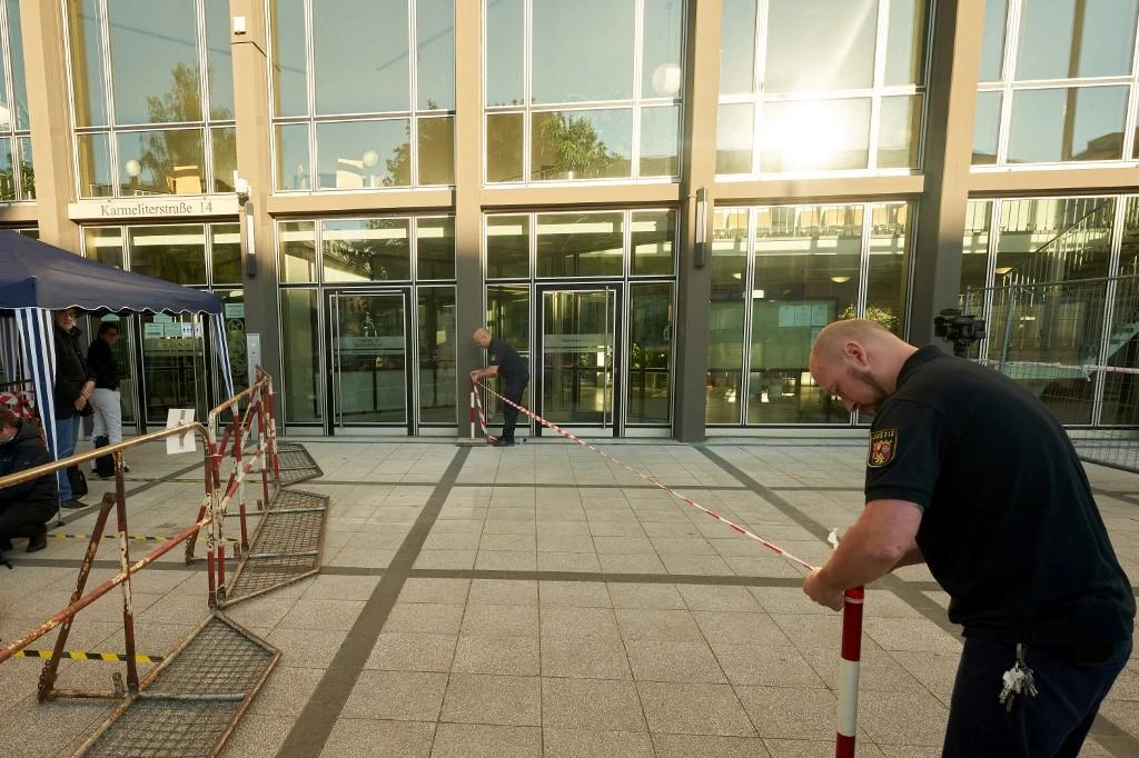 German prison officers prepare waiting lines outside the court building prior to the start of a trial against two Syrian defendants accused of state-sponsored torture in Syria, on April 23, 2020 in Koblenz. (File/AFP)