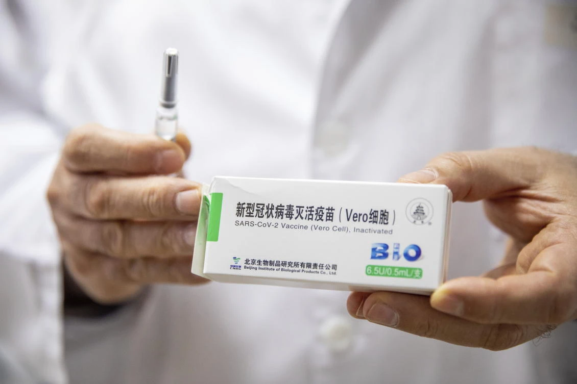 Csaba Lengyel, President of the University of Szeged's Szent-Gyorgyi Albert Clinic Center shows a pack of the vaccine against COVID-19 produced by Chinese Sinopharm at the university in Szeged, Hungary, Wednesday, February 24, 2021. (AP)
