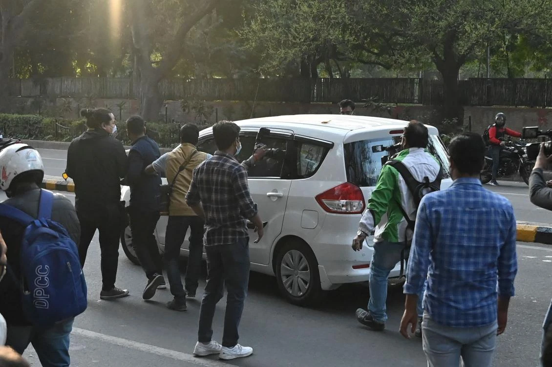 Environment activist Disha Ravi is driven away on a vehicle from a local court after being granted bail, in New Delhi on February 23, 2021. (AFP)