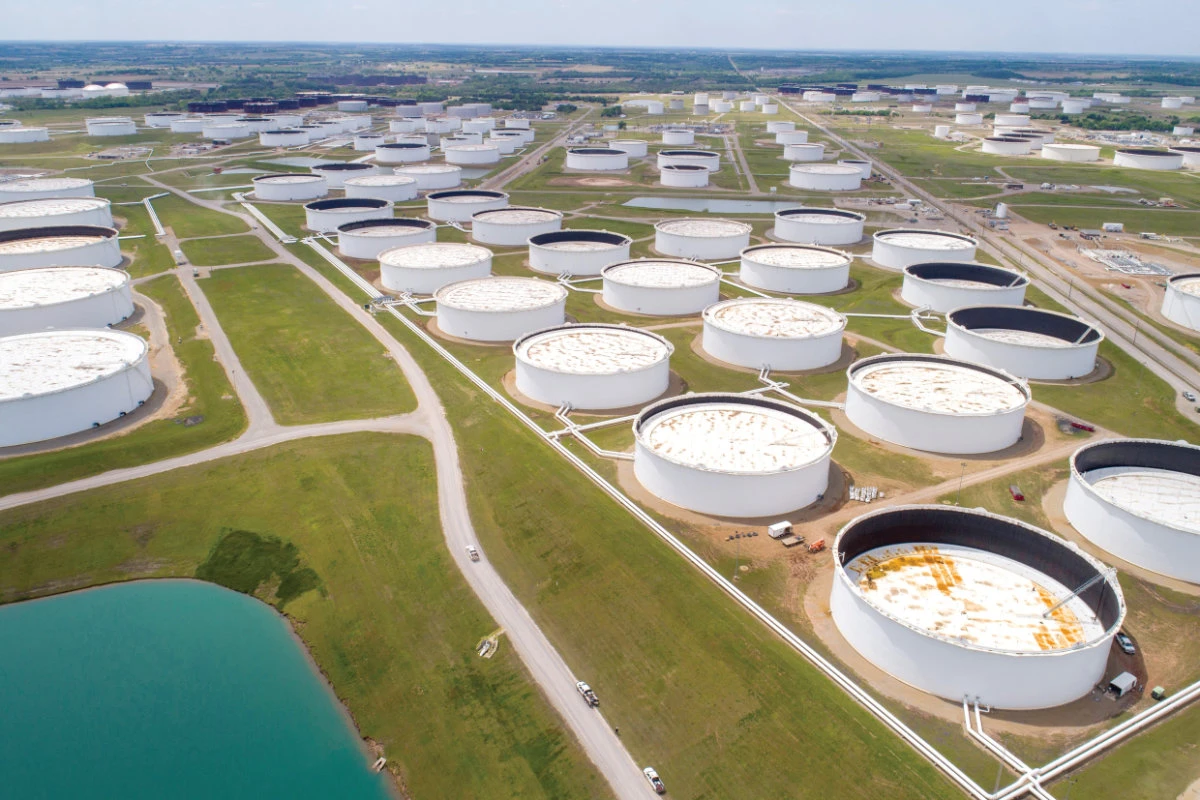 Oil hovers near 13-month  highs as storm dents US output