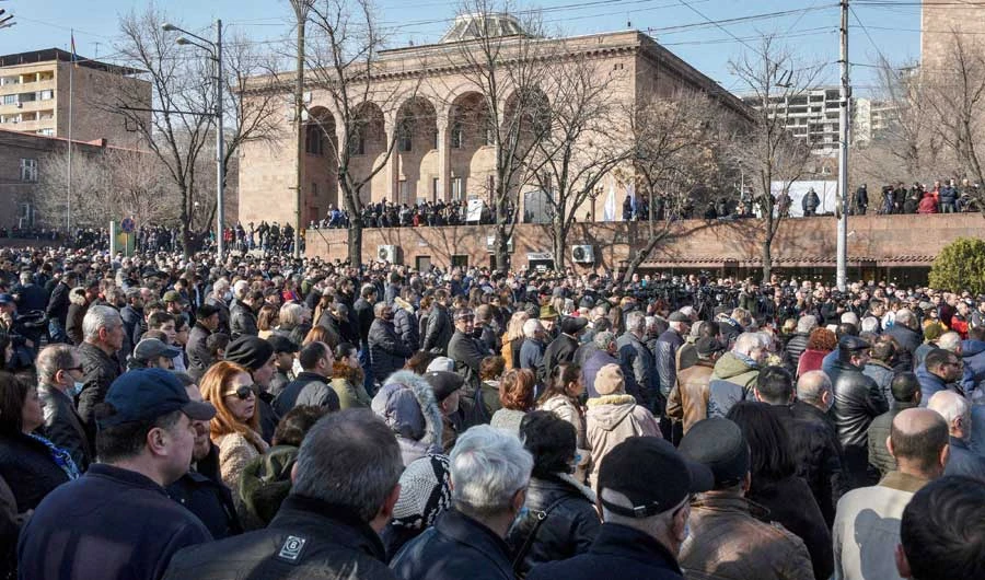 Opposition supporters rally outside the National Assembly building to demand the Prime Minister's resignation over his handling of last year's war with Azerbaijan, in Yerevan on February 27, 2021. (AFP)