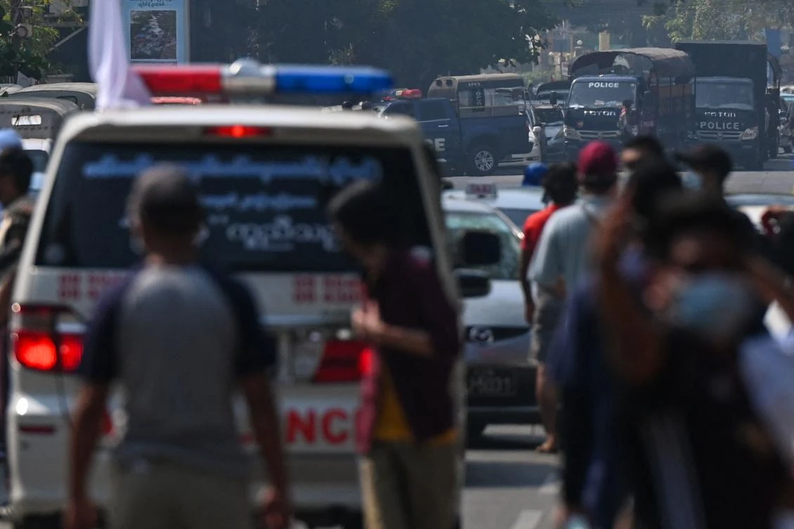 Police vehicles are seen in Yangon on February 28, 2021 as security forces continue a crackdown on demonstrations by protesters. (AFP)