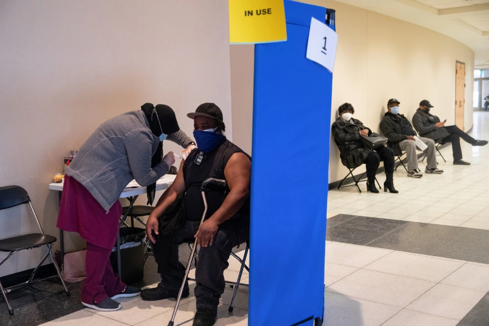 Seniors receive their coronavirus disease (COVID-19) vaccinations at Second Ebenezer Church in Detroit, Michigan, US, on Feb. 27, 2021. (REUTERS/Emily Elconin)