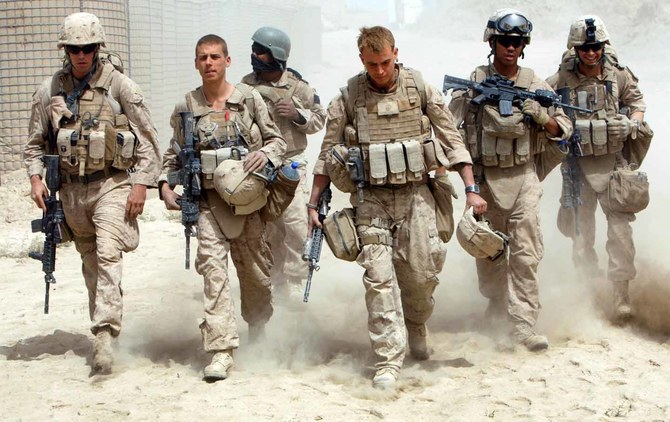 A US Navy hospital corpsman and US Marines inside a base in southern Afghanistan. (Reuters)