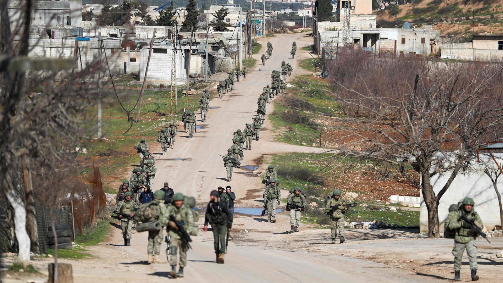 Turkish soldiers advance along a road in Idlib Province, Syria, Feb., 2020. (AFP)