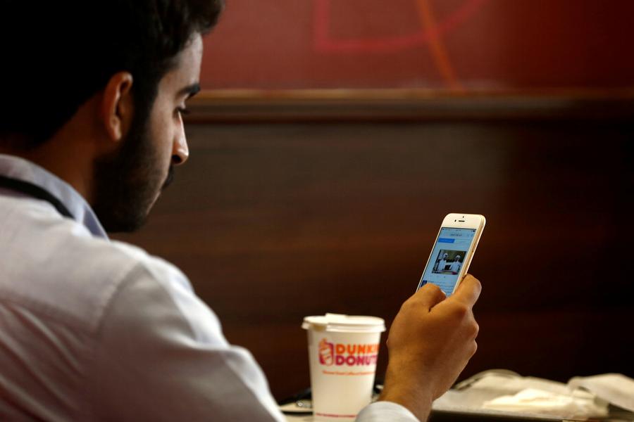 People spend almost seven hours a day using the internet on various devices — this means that we spend almost half of our waking time online. (Reuters)